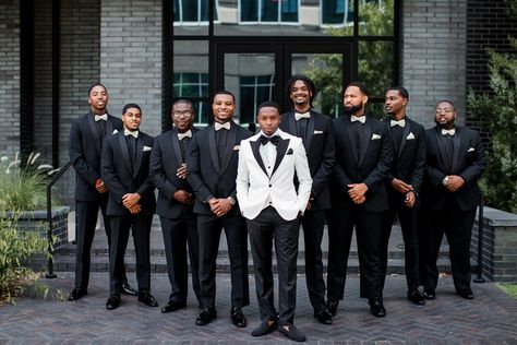 This wedding party photo deserves to be on the cover of Vogue. The groom wore a white blazer with black lapels. To create some contrast the groomsmen wore all-black suits with white bowties for their The Cordelle Wedding in Nashville, TN | John Myers Photography & Videography Black Groomsmen Suits, The Cordelle, Groom Suit Black, John Myers, Groomsmen Poses, Groomsmen Style, Side Photo, Nashville Wedding Venues, Groomsmen Outfits