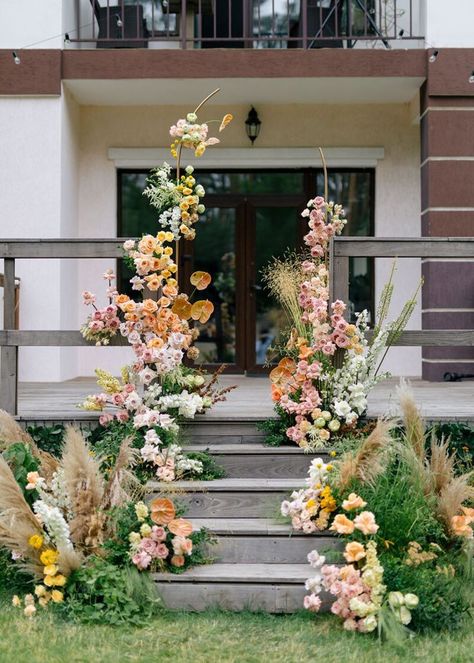 Wedding Deck Decorations, Floral Meadow Wedding Ceremony, Tan Bridesmaid Dresses Colorful Flowers, Lush Garden Wedding, Backyard Wedding Florals, Backyard Garden Party Wedding, Roses Wedding Aisle, Backyard Wedding Flowers, Backyard Wedding Arch