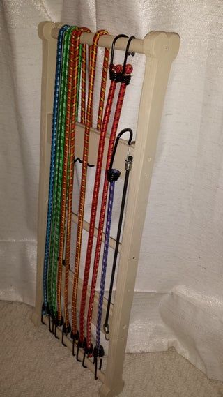 Bony Bungee Cord Organizer : 5 Steps - Instructables Bungee Cord Storage, Outdoor House Paint, Miter Saw Table, Saw Wood, Cord Organizer, Bungee Cords, Ways To Organize, Cord Storage, Cord Organization