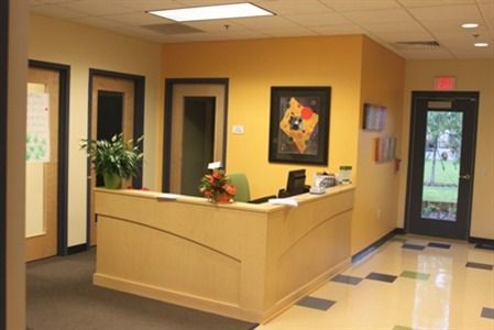 Daycare Reception Area Ideas, Daycare Entrance, Childcare Lobby Ideas, Preschool Foyer Entrance, Daycare Entrance Ideas Entryway, Daycare Office, Daycare Reception Area, Daycare Building, Childcare Foyer Displays