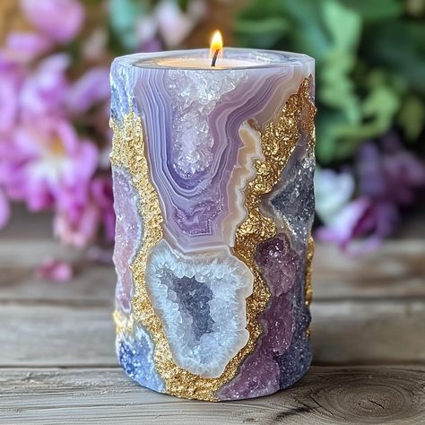 The Geode Candle is a stunning, nature-inspired piece that combines the beauty of crystals with the warmth of candlelight. Shaped like a real geode, the outer surface mimics the rugged texture of stone, while the inside reveals intricate, crystal-like formations that sparkle when illuminated. Hand-poured with premium, long-lasting wax, each candle boasts a unique, gemstone-like appearance, offering a blend of art and ambiance. As the candle burns, it casts a soft, radiant glow, creating a soo... Geode Candle Holder, Geode Candle, Luxurious Candles, Gemstone Candles, Geode Decor, Stunning Nature, Candle Glow, Unique Products Design, Black Witch