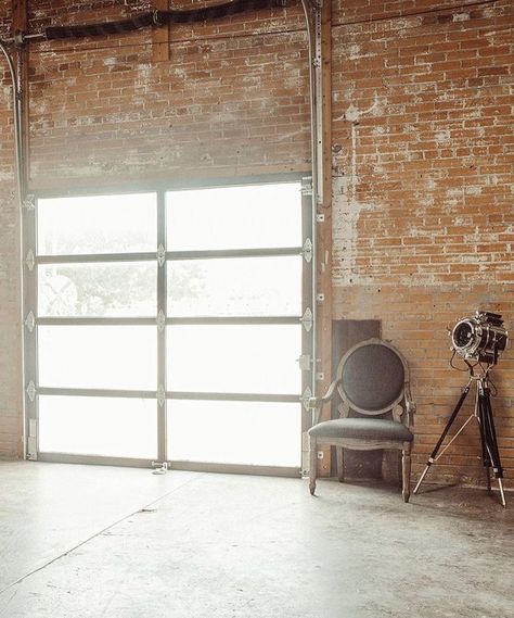 Exposed brick translucent garage door photography studio Garage Photo Studio, Photography Studio Building, Brick Photography Studio, Garage Photography Studio, Photography Studio Design, Brick Interior Wall, Garage Studio, Dream Studio, Interior Photo