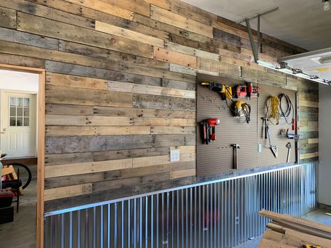 Pallet wood, peg board, and corrigated steel Wood Peg Board, Garage Wood Shop, New Garage, Pallet Boards, Garage Ideas, Shop Wall, Peg Board, Pallet Wood, Pallet Diy