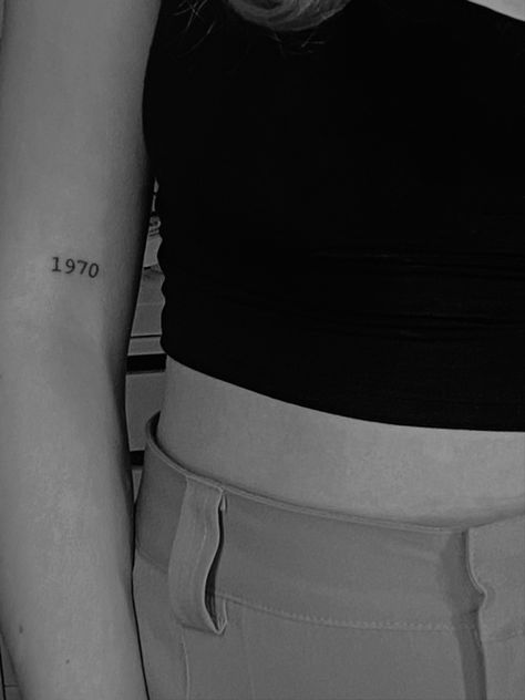 70 Tattoo Number, 1970 Tattoo Ideas, Typewriter Font Tattoo Numbers, Year Fine Line Tattoo, 1940 Tattoo Number, 1971 Tattoo Font, 1950 Tattoo Number, Arm Number Tattoo, Fine Line Tattoo Numbers