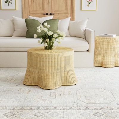 This coastal inspired coffee table features a unique scalloped skirt design that contradicts traditional lines. Handwoven, sustainable rattan creates a unique undulating scalloped pattern of slightly flared wicker curves that skirt the floor, giving the illusion of a billowing fabric. This statement coffee table is an iconic focal point for your beach house or any organic modern space. Best of all, it arrives fully assembled. Birch Lane™ | Birch Lane™ Cabo Woven Rattan Coffee Table Brown | C1115 Billowing Fabric, Statement Coffee Table, Poolside Furniture, Coffee Table Brown, Scalloped Skirt, Natural Living Room, Rattan Coffee Table, Coastal Living Room, Woven Rattan