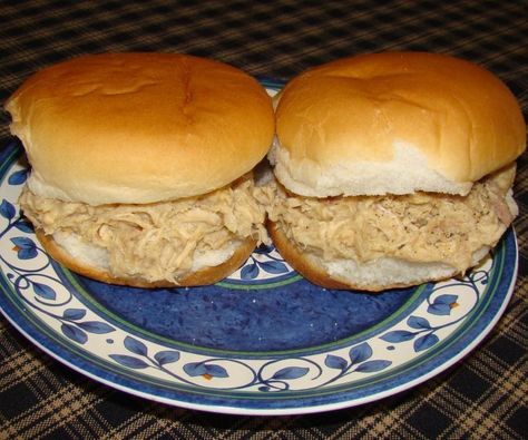 Here is a very quick and easy recipe for shredded chicken sandwiches. These sandwiches are very popular in this area (Ohio). You will find them being served at all kinds of gatherings, from parties to potlucks and they are sold at most local ice cream shops. Lots of families have their own secret shredded chicken recipes. Some cooks insist on cooking and deboning a whole chicken then adding fillers from breadcrumbs to crackers. This recipe requires only canned chicken, cream of chicken soup,... Chicken Breast Sandwich Recipes, Shredded Chicken Sandwiches, Chicken Breast Sandwich, Braised Chicken Breast, Chicken Sandwich Recipe, Hot Chicken Sandwiches, Chicken Lunch Recipes, Easy Shredded Chicken, Can Chicken Recipes