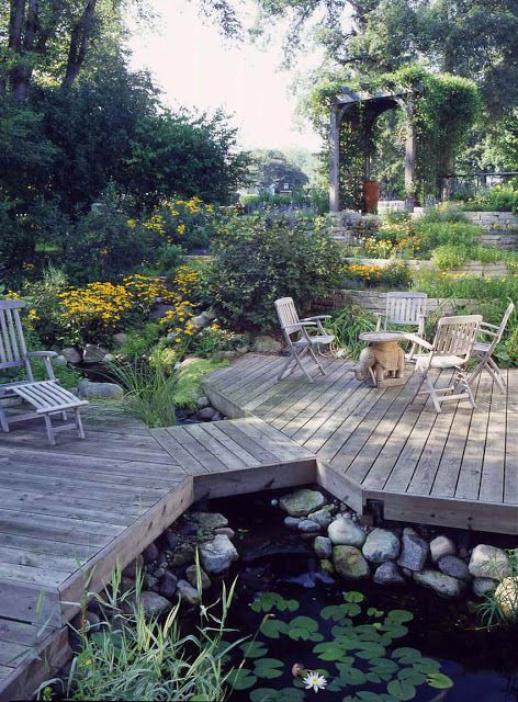 This unique deck dissects the pond, providing multiple viewing areas to enjoy the abundant aquatic plants and surrounding landscape. #backyardideas #pond #aquaticplants #deck #landscapedesign Building A Pond, Garden Pond Design, Outdoor Ponds, Fountains Backyard, Pond Water Features, Pond Landscaping, Backyard Water Feature, Natural Pond, Green Acres