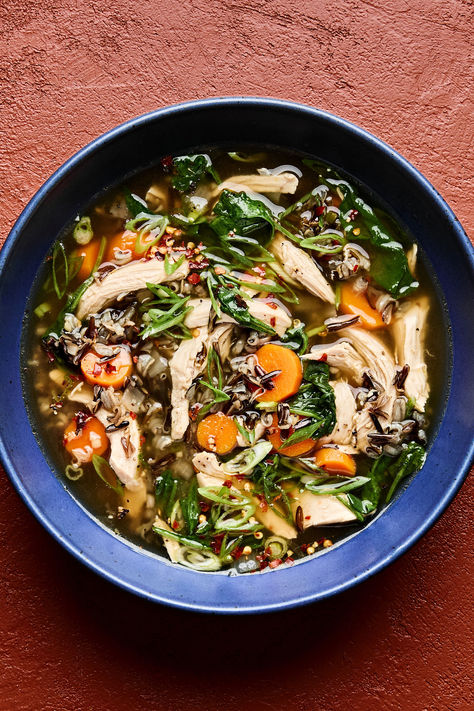 a bowl of chicken and wild rice soup made with carrots, spinach, garlic, ginger, spinach & green onions Leftover Chicken Soup, Fresh Dinner Ideas, Cherish Your Loved Ones, Green Chicken Enchiladas, Chicken And Wild Rice Soup, Wild Rice Soup Recipes, Chicken Wild Rice, Perfect Grilled Cheese, The Modern Proper