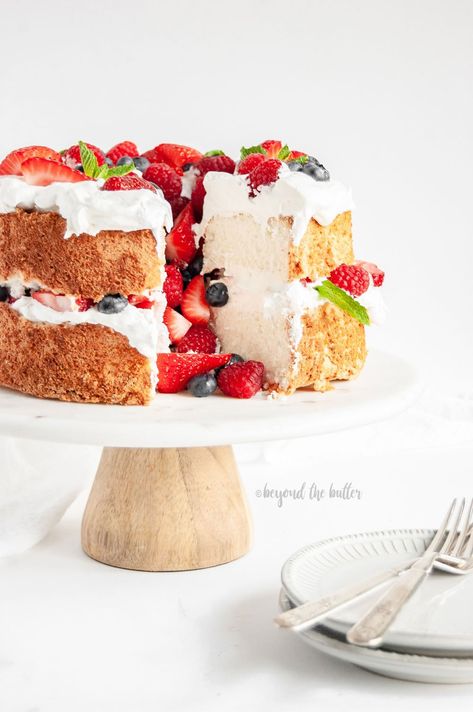 This Angel Food Cake with Berries is SO EASY to make and tastes wonderful paired with fresh fruit and whipped cream - or - just as it is! It's a great summer dessert that doesn't feel heavy or rich. #angelfoodcake #whippedcream #beyondthebutter #coolwhip #angelfood Angel Food Cake With Berries, Fruit Tart Glaze, Fruit And Whipped Cream, Homemade Angel Food Cake, Cake With Berries, Fruit Birthday Cake, Easy Fruit Pizza, Fresh Fruit Tart, Best Summer Desserts