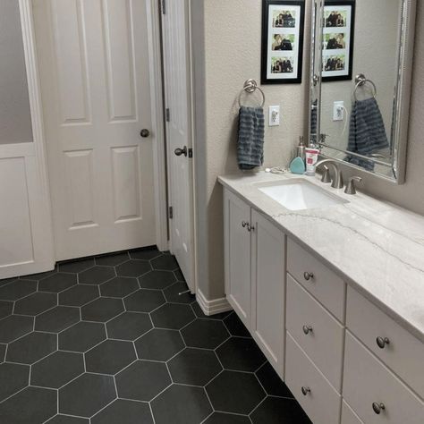 These Bathrooms Prove Hexagon Floor Tile Is Stunning Bathroom Black Tile Floor Ideas, Bathrooms With Black Hexagon Tiles, Master Bath Hexagon Floor, Slate Hexagon Tile Bathroom, Black Floor Bathroom Ideas Tile, Hexagon Vinyl Flooring Bathroom, Bathrooms With Black Tile Floors, Black And White Octagon Tile Bathroom, Black Flooring Bathroom