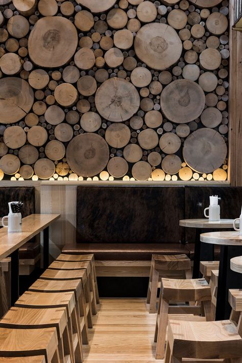 Accent Wall Ideas - 12 Different Ways To Cover Your Walls In Wood // The cross sections of tree stumps displayed on this wall bring in warmth and mimic the natural look of a forest floor. Wood Feature Wall, Log Wall, Rustic Bar, Wood Accent Wall, Into The Wood, Bar Interior, Tables And Chairs, Restaurant Interior Design, Into The Woods