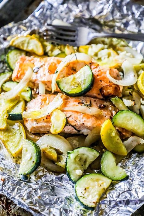 Garlic Herb Salmon and Zucchini Foil Packets - a delicious, complete meal bursting with flavor from one foil pouch! Salmon And Zucchini Recipes, Garlic Herb Salmon, Salmon With Zucchini, Salmon And Zucchini, Salmon Foil Packets, Herb Salmon, Zucchini Recipes Baked, Foil Packet Dinners, Zucchini Recipes Healthy