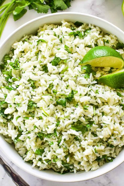 The BEST Cilantro Lime Rice - made with just 5 ingredients and ready in 30 minutes or less. A bright, fresh side dish that instantly elevates any meal! Cilantro Lime Minute Rice, Lime And Cilantro Rice, Lime Rice Cilantro, Rice Recipes For Dinner Side Dishes, Rice With Cilantro And Lime, Mexican Side Dishes Easy, Rice Cilantro Lime, Chipotle Lime Rice, Lime Cilantro Rice