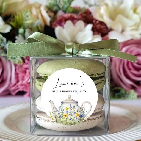 "10 sets of personalized flower bridal shower tea party favors macaron packaging boxes. https://cookieboxstore.com for more designs. Each box holds 2 macarons. Easy assembling. Perfect for your wedding favors. You can also customize these for your bridal shower favors, birthday favors, baby shower favors, religious events, and more. These sets are perfect for 2 macaron favors but you can also use them for a small cookie box, candy box, small candle box, small ornament box,..etc -What is included in the set 10 clear boxes 10 ribbons 10 stickers *Macarons are not included* // Box Size W x L x H // approx 1.9\" x 1.9\" x 1.9\" [inch] approx 5cm x 5cm x 5cm The diameter of the macaron should be less than 1.9\" /5cm // Ribbon color // Please see the picture // Quantity // 10 sets in 1 pack (Qua High Tea Party Favors Gift Ideas, Bridal Shower Tea Favors, High Tea Party Favors, Sweet 16 Tea Party, Tea Party Bridal Shower Favors, Macarons Easy, Macaron Packaging, Ribbon Label, Bridal Shower Luncheon