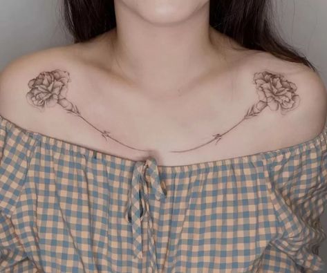 The Meanings Of Carnation Tattoos (Explained In Detail) Purple Carnation Tattoo, Carnation And Marigold Tattoo, Simple Carnation Tattoo, Collarbone Tattoos For Women, Carnation Tattoos, Carnation Flower Tattoo, Collarbone Tattoos, Marigold Tattoo, Carnation Tattoo