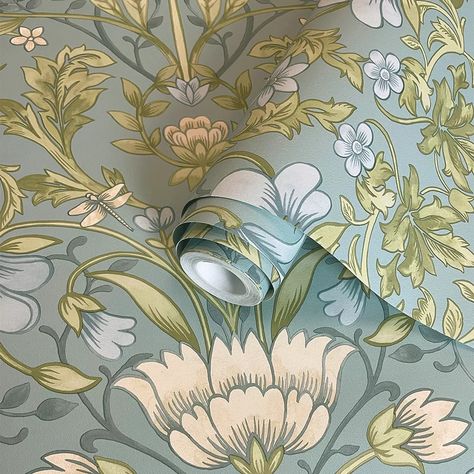 A mirrored floral paper with a traditional design featuring flower heads framed by trailing vines creating an impactful look on your walls. Shown here in the soft blue colourway  other colourways available. Vintage Floral Wallpaper, Albany Wallpaper, Vines Leaves, Painterly Style, Designer Patterns, Vintage Floral Wallpapers, Muted Colours, Garden Wallpaper, Wall Art Wallpaper