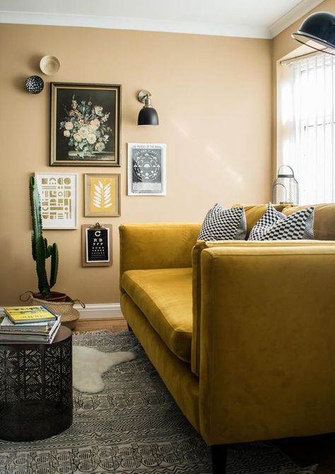 a boho nook with yellow walls, a mustard sofa, a gallery wlal and sconces and layered rugs plus a potted cactus Shaker Living Room, Velvet Couch Living Room, Mustard Living Rooms, Mustard Sofa, Parisian Living Room, Maximalist Living Room, Bold Living Room, Moody Living Room, Yellow Couch