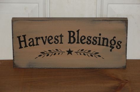 HANDMADE~I have painted this primitive Harvest Blessings wood sign in tan with black underneath the topcoat. It has been distressed for more of a primitive look. Nice primitive fall décor accent that can be used as a shelf sitter, or can be hung on the wall. You will have your choice of sign colors, and hanging options. Measure approx. 5.5 x 12 wide MADE TO ORDER ITEM Harvest Wood Signs, Fall Shelf Sitters, Fall Harvest Crafts, Primitive Fall Decor, Harvest Crafts, Fall Autumn Decor, Harvest Sign, Harvest Blessings, Primitive Fall