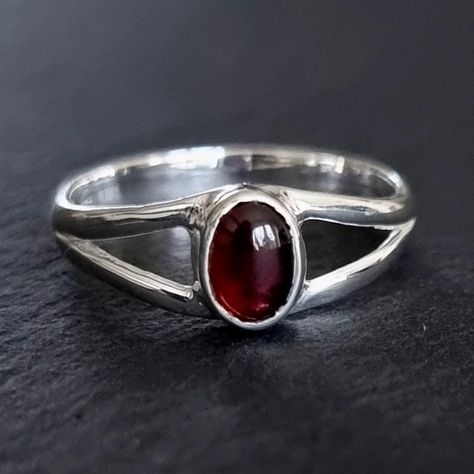 💖  Product Description Dainty Garnet Ring - Oval 925 Sterling Silver Garnet Ring Garnet is the January Birthstone and 2nd Anniversary Gemstone 💖 Product Details *  925 Sterling Silver *  Handmade *  Total Ring Length - 8mm *  Stone Size - 7mm x 5mm *. Stone Height - 3mm *  Weight - 2.8g *  Band Width - 3mm 💖 Ring Sizing If you're unsure of your finger size, please purchase the reusable plastic ring sizers we have available and follow the instructions in the FAQ section to determine your finge Garnet Ring Silver, Sterling Silver Garnet Ring, Boho Jewellery, Everyday Ring, 2nd Anniversary, Dope Jewelry, Garnet Jewelry, Downtown Girl, Red Gemstones