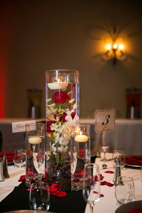 White Tablecloths With Black Runner, Red Black And White Centerpiece Ideas, Red And Cream Centerpieces, Elegant Black And White And Red Wedding Table Decor, Red Black White And Gold Wedding Receptions, Red Wedding Theme Centerpieces, Red And Gold Centerpieces Wedding, Red Black Gold White Table Setting, Red Black And Grey Wedding Ideas