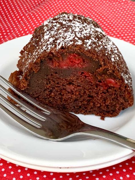 Piece of chocolate bundt cake with cherries on a white plate with a fork Black Forest Bundt Cake Recipe, Black Forest Bundt Cake, Chocolate Bundt Cake Recipe, Devils Food Cake Mix Recipe, Chocolate Bundt, Bundt Cake Recipe, Chocolate Bundt Cake, Easy Chocolate Cake, Cherry Cake