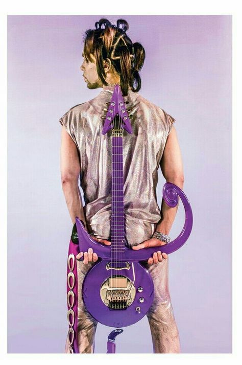 Prince's back with love symbol guitar behind him. Circa 1999 photo by Steve Parke O(+> Prince 1999, Prince Concert, Prince Musician, Prince Images, Rick James, Sheila E, Prince Tribute, The Artist Prince, Pictures Of Prince