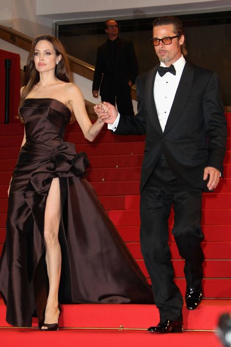 Angelina Jolie and Brad Pitt leave The Tree of Life premiere during the 64th Annual Cannes Film Festival on May 16, 2011, in Cannes, France. Getty -Cosmopolitan.com Angelina Jolie Make Up, Angelina Jolie Red Carpet, Versace Atelier, Angelina Jolie Style, Brad And Angelina, Brad Pitt And Angelina Jolie, Angelina Jolie Photos, Jolie Pitt, Girl Interrupted