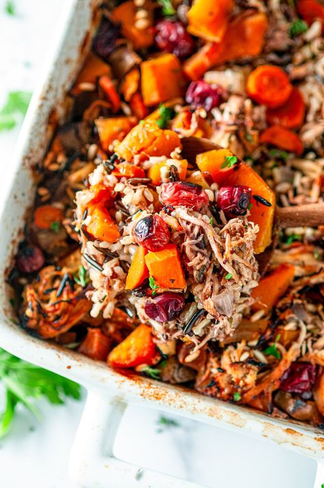 An easy, comforting, classic dish, this flavorful autumn chicken wild rice casserole recipe uses butternut squash, apples and cranberries for a fun fall twist. Plus, it's naturally gluten and dairy free! From aberdeenskitchen.com #autumn #chicken #wildrice #casserole #fall #dinner #familyfriendly #recipe Chicken And Wild Rice Casserole With Butternut Squash And Cranberries, Butternut Squash Wild Rice Casserole, Autumn Casserole Recipes, Healthy Fall Casserole Recipes, Dairy Free Fall Recipes, Dinner Party Casseroles, Dairy Free Casserole, Fall Casserole, Fall Casserole Recipes