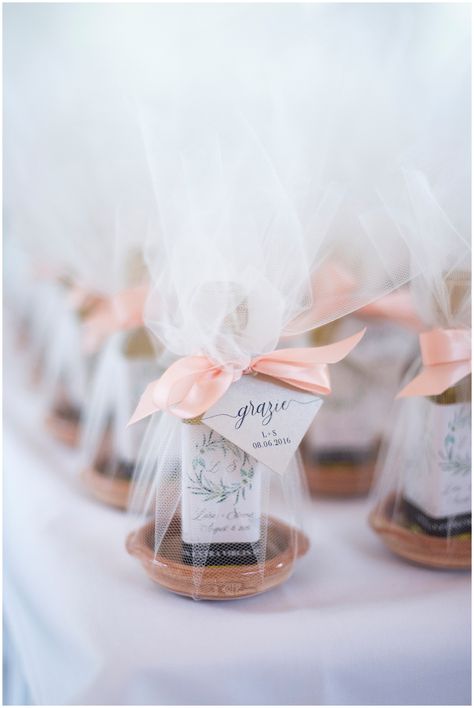 The best wedding favor from an Italian couple - olive oil with a small dipping dish wrapped in tulle and ribbon! • Wedding Favor • Italian Wedding Ideas • Olive Oil Wedding Favor • Grazie • DIY Favors • Useful Wedding Favor Italian Wedding Ideas, Olive Oil Wedding Favors, Olive Oil Favors, Diy Wedding Favors Cheap, Italian Wedding Favors, Diy Favors, Bottle Opener Favors, Homemade Wedding Favors, Pola Macrame