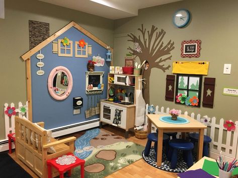 Check out the chimney and the picket fence... soooo cute! #preschool Home Daycare Ideas, Daycare Rooms, Daycare Decor, Preschool Rooms, Daycare Room, Dramatic Play Area, Dramatic Play Preschool, Preschool Centers, Toddler Classroom