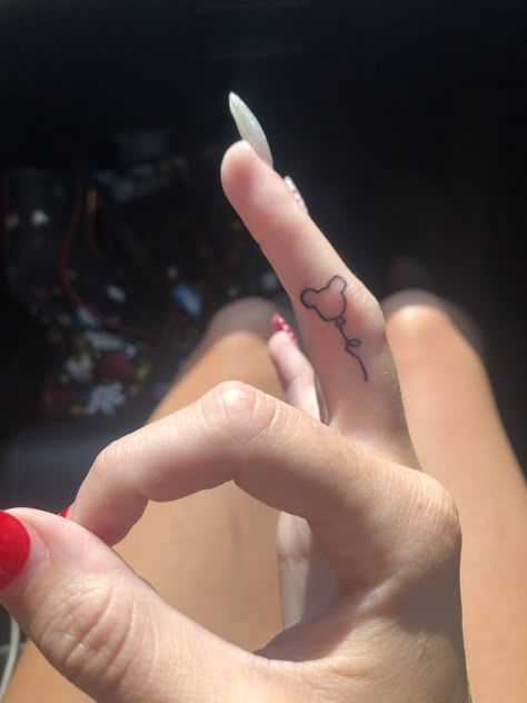 Mickey Finger Tattoo, Behind The Ear Tattoo Ideas Disney, Classy Disney Tattoos, Simplistic Disney Tattoo, Finger Tattoos Disney, Minnie Ear Tattoo, Dainty Disney Tattoos For Women, Small Simple Disney Tattoos, Disney Sister Tattoos For 2