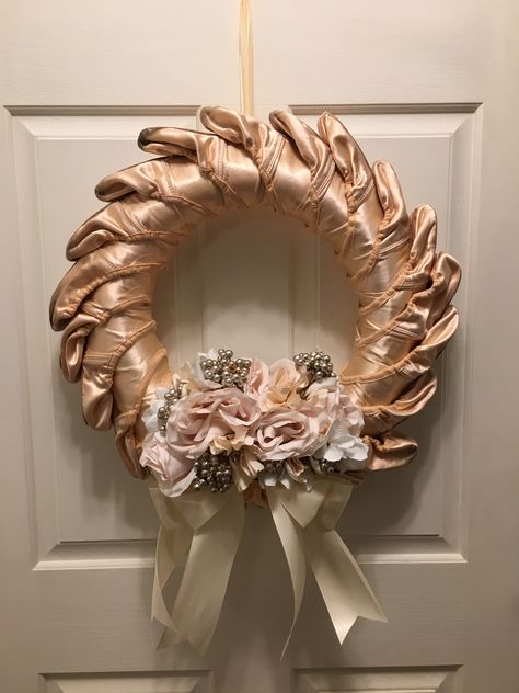 A wreath made from used/dead ballet pointe shoes. Old Pointe Shoes Display, Pointe Shoes Decoration, First Pointe Shoes Display, Things To Do With Old Pointe Shoes, Framed Ballet Shoes, Bedazzled Pointe Shoes, Pointe Shoe Decorations, What To Do With Old Pointe Shoes, Pointe Shoe Christmas Tree