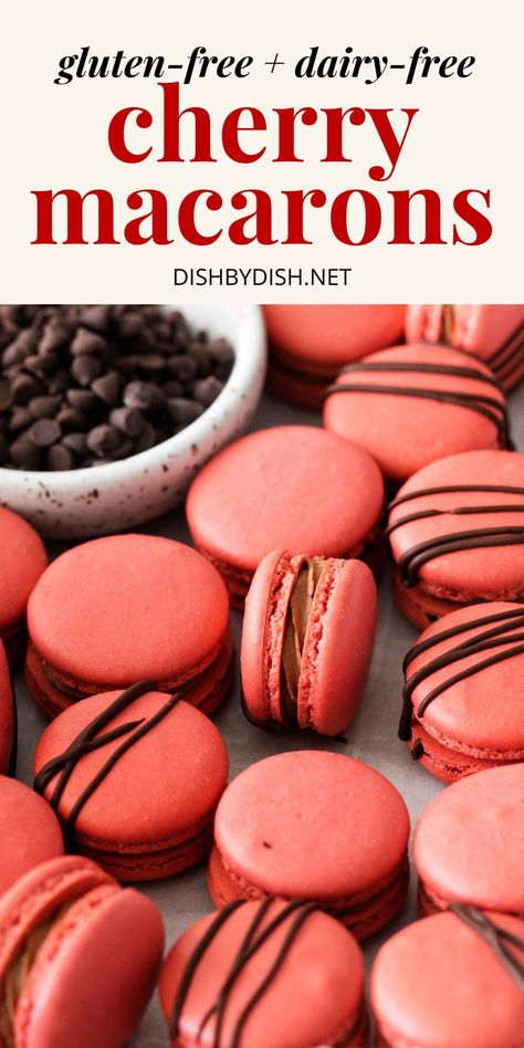 Up close shot of cherry macarons on parchment paper. Chocolate Covered Cherry Macarons, Chocolate Cherry Macarons, Sugar Free Macarons, Macrons Recipes Flavors, Dairy Free Macarons, Valentines Day Macarons, Macaron Recipe Flavors, Valentines Macarons, Sweet Cherry Jam