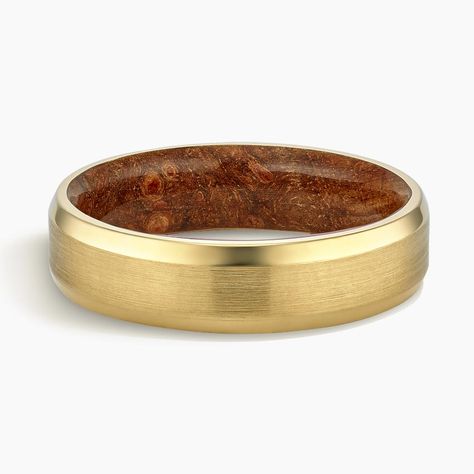 Men's 18K Yellow Gold Hardwood and Maple Burl Wood Satin Finish 6mm Wedding Ring. Lightweight and unique, this mixed material ring features a precious metal satin finish exterior and a maple burl hardwood interior that's coated in a protective resin.     Burl is a rare and prized pattern of tight swirls in maple wood that varies in color from honey to medium brown.     To properly care for a hardwood ring, read our Jewelry Care Guide. Good Wedding Band For Men, Mens Ring Guide, Gold Marriage Ring, Groom Wedding Rings, Unique Wedding Ring For Men, Men’s Gold Band, Men's Engagement Ring, Gold Men Wedding Bands, Mixed Metal Mens Wedding Bands