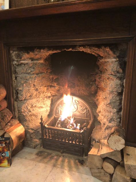 A vertical guard bar at the front, placed to prevent logs from rolling into the rooms, is often decorated ornately. (Rear guard bars were in use until the 14th century, when the central open hearth as a mode of heating went out of general use.) The grate, a sort of basket of cast-iron grillwork, came into use in the 11th century and was especially useful for holding coal. Open Hearth Fireplace, Coal Fireplace, Fireplace Guard, Fireplace Grate, 11th Century, 14th Century, Old House, Old Houses, Cast Iron