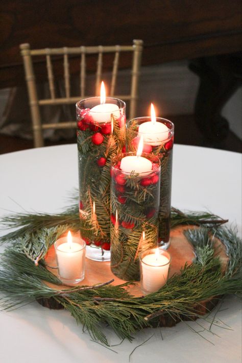 Mini Christmas Tree Centerpiece Wedding, Winter Floating Candle Centerpiece, Simple Winter Wedding Ideas, Holiday Wedding Tablescape, Floating Candles Cranberries, Christmas Party Round Table Decor, Winter Wedding Centerpieces Table Decor, Christmas Wedding Trees, Small Christmas Wedding At Home