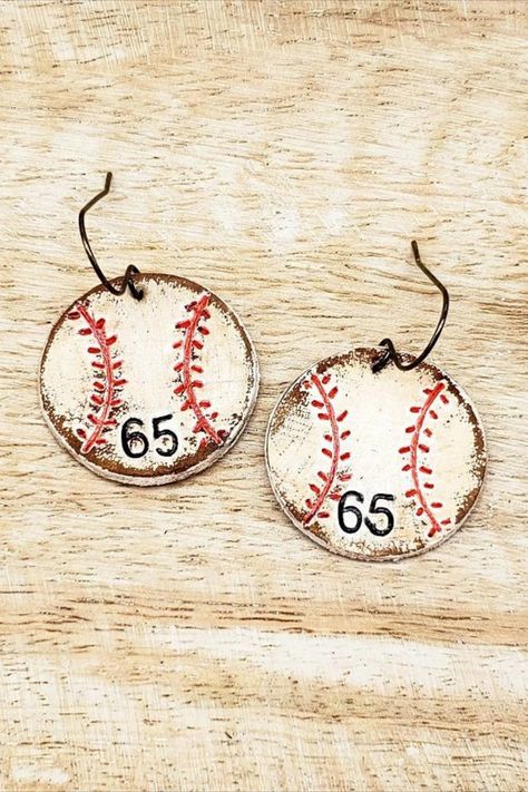 Take me out to the ballgame! These custom hand painted genuine leather baseball earrings can be personalized with your player's number!

I have embossed the baseball stitching on genuine leather. I then hand paint, distress and stain the leather to create a rustic look...so fun! I can also emboss your player's number on the earrings. Plain baseballs with no numbers are also an available option. Laser Gifts, Baseball Earrings, Diy Leather Earrings, Take Me Out, Custom Hand Painted, Leather Diy, Minimalist Earrings, Leather Earrings, Etsy Earrings