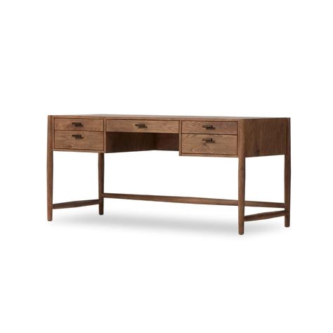 Traditional, reimagined. Made from rustic weathered oak, this desk brings generous storage space to the office. Simple hardware is finished in an aged bronze.Product Overview Finish: Aged Bronze Dimensions: 67.5"W x 27.5"D x 31"H Materials: Iron, Thick Oak Veneer, Solid Oak Weight: 148.37 lb Specifications Distance Bet Iron Desk, Wood Writing Desk, Iron Hardware, Aged Bronze, Amber Interiors, Weathered Oak, Executive Desk, Four Hands, Oak Veneer