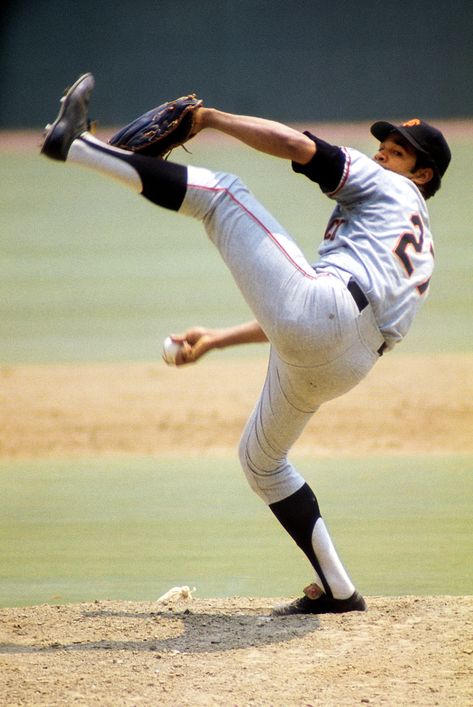 Juan Marichal, who was inducted into the Hall of Fame in 1983, utilized a high leg kick throughout his 16-year career in the majors. San Francisco Giants Baseball, Action Pose Reference, Male Pose Reference, Baseball Pictures, Baseball Print, Giants Baseball, Baseball Photos, Action Pose, Mickey Mantle