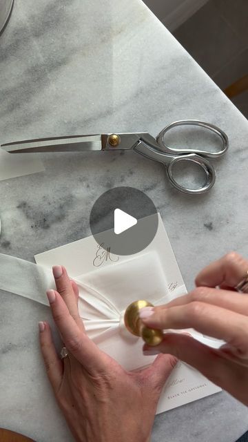 Wedding Invitation Designer | Kate Bessell on Instagram: "Hand pouring wax seals ✨So much care goes into assembling each and every one of my couples invitation suites but the end result is worth it every time. This pairing of pearl white wax seals, silk ribbon, and gold foil creates the most magical experience for guests to open up! YUM" Wedding Invitation Wrapping Ideas, 2025 Wedding Invitations, Wedding Invitation Ideas Diy, Wax Seal On Ribbon, Vellum Wax Seal Invitation, Wax Seal Invitations, Wax Seal Ideas, Wedding Invitations With Ribbon, Wedding Invitations Wax Seal