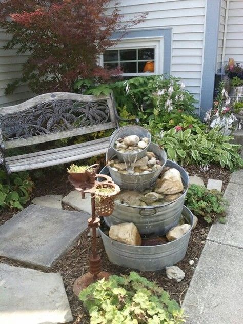 glavinized tub fountains | Wash tub fountain Diy Galvanized Tub Water Fountain, Whimsical Garden Fountain, Galvanized Tub Water Feature, Washtub Fountain, Galvanized Tub Fountain, Yard Fountain, Diy Solar Fountain, Fountain Ideas, Rustic Landscaping