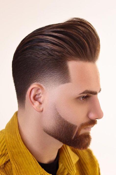 You will love this pompadour haircut as it requires minimal styling. It is, therefore, a good choice for you if you have a busy schedule all the time. Clean Mens Haircut, Haircut Pompadour, Buzz Fade, Hairstyles For Square Faces, Side Part Pompadour, Popular Hairstyles For Men, Short Pompadour, Fade Haircut Designs, Pompadour Haircut