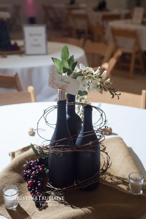 31 Beautiful Wine Bottles Centerpieces Perfect For Any Table Vineyard Wedding Centerpieces, Twig Centerpieces, Wine Themed Wedding, Wine Theme Wedding, Lanterns Diy, Wine Bottle Centerpieces, Old Wine Bottles, Bottle Centerpieces, Tafel Decor