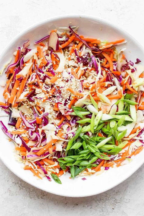 Sesame Ginger Slaw - a light, refreshing and flavorful sesame ginger slaw recipe that is perfect for tacos or as its own side dish! #sesamegingerslaw #sidedish #whole30recipes #homemadeslaw Coleslaw Salad Recipe, Ginger Slaw, Asian Cabbage Salad, Asian Cabbage, Ginger Vinaigrette, Pork Belly Tacos, Buttered Cabbage, Healthy Coleslaw, Ramen Noodle Salad