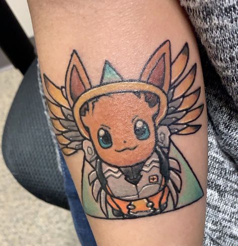 Mercy Tattoo Overwatch, Overwatch Tattoo Ideas, Mercy Tattoo, Eevee Tattoo, Overwatch Tattoo, Pokemon Mashup, Silly Tattoos, Nerd Tattoo, Mercy Overwatch