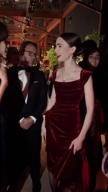 Eternal Goddess on Instagram: "Actress Lily Collins glows in a red velvet gown at a @cartier event ❤️ 🎥 @galafr - #eternalgoddess #emilyinparis #cartier #redcarpetfashion #redvelvet #couturegown" Lily Collins Cartier, Dark Red Dress Prom, Royal Gowns Princesses, Red Outfit Dress, Dark Red Formal Dress, Lily Collins Outfit, Red Velvet Dress Outfit, Red Bridal Party, Red Velvet Design