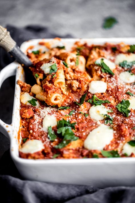 A new take on baked ziti with this lightened up saucy baked pumpkin pasta with creamy pumpkin puree, ground turkey sausage, red bell pepper, mushrooms, marinara, ricotta, mozzarella, parmesan, parsley and your favorite pasta! #pastarecipe #healthydinner #dinnerrecipe #pumpkinrecipe #fallrecipe #familydinner Pumpkin Pasta Bake, Ambitious Kitchen Recipes, Autumn Pasta Recipes, Pumpkin Pasta Recipe, Ground Turkey Sausage, Pumpkin Lasagna, Fall Pasta, Pumpkin Recipes Healthy, Pumpkin Pasta