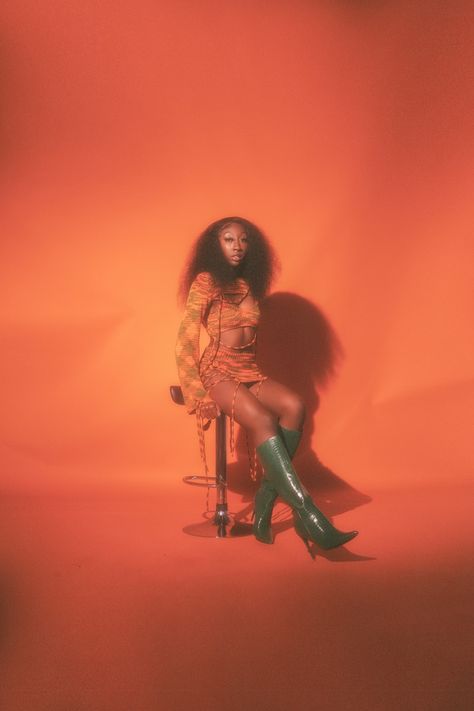 Orange And Green Photoshoot, Creative Studio Shoot Ideas Black Women, Burnt Orange Backdrop Photoshoot, Orange Backdrop Photoshoot Ideas, Hair Light Photography, Burnt Orange Photoshoot, 70s Inspired Photoshoot Black Women, Orange Theme Photoshoot, Fire Theme Photoshoot