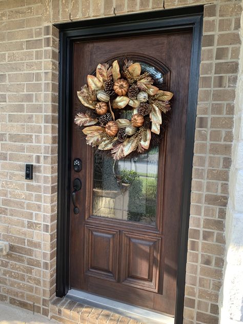 Updated front door - re-stained dark brown and painted door frame Tricorn Black (SW) to match shutters! I❤️my door now 😊 Updated Front Door, Tricorn Black Front Door, Garage Door Lights, Painted Exterior Doors, Brown Front Doors, Mahogany Entry Doors, Tan House, Tricorn Black, Black Front Door