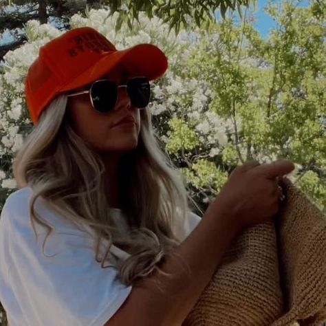 Lexie Marie on Instagram: "Quick road-trip outfit check🚗🧡📸 My favorite shorts of all time @tacoolathelabel - let me just say I normally hate jean shorts but Tacoola does them best! These are the Stella short and I also have the Honey! Tee & trucker hat @blue_jean_b3auty_ Sunnies @elusive_eyewear Bag @mondayswimwear Hair @monatofficial" Orange Trucker Hat Outfit, Trucker Hat Outfit Women, Trucker Hat Outfit, Road Trip Outfit, Hat Outfits, Yee Yee, Trip Outfit, Trip Outfits, Outfit Check